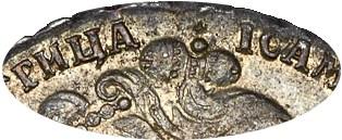 Деталь монеты полтина 1734 года  корона разделяет надпись